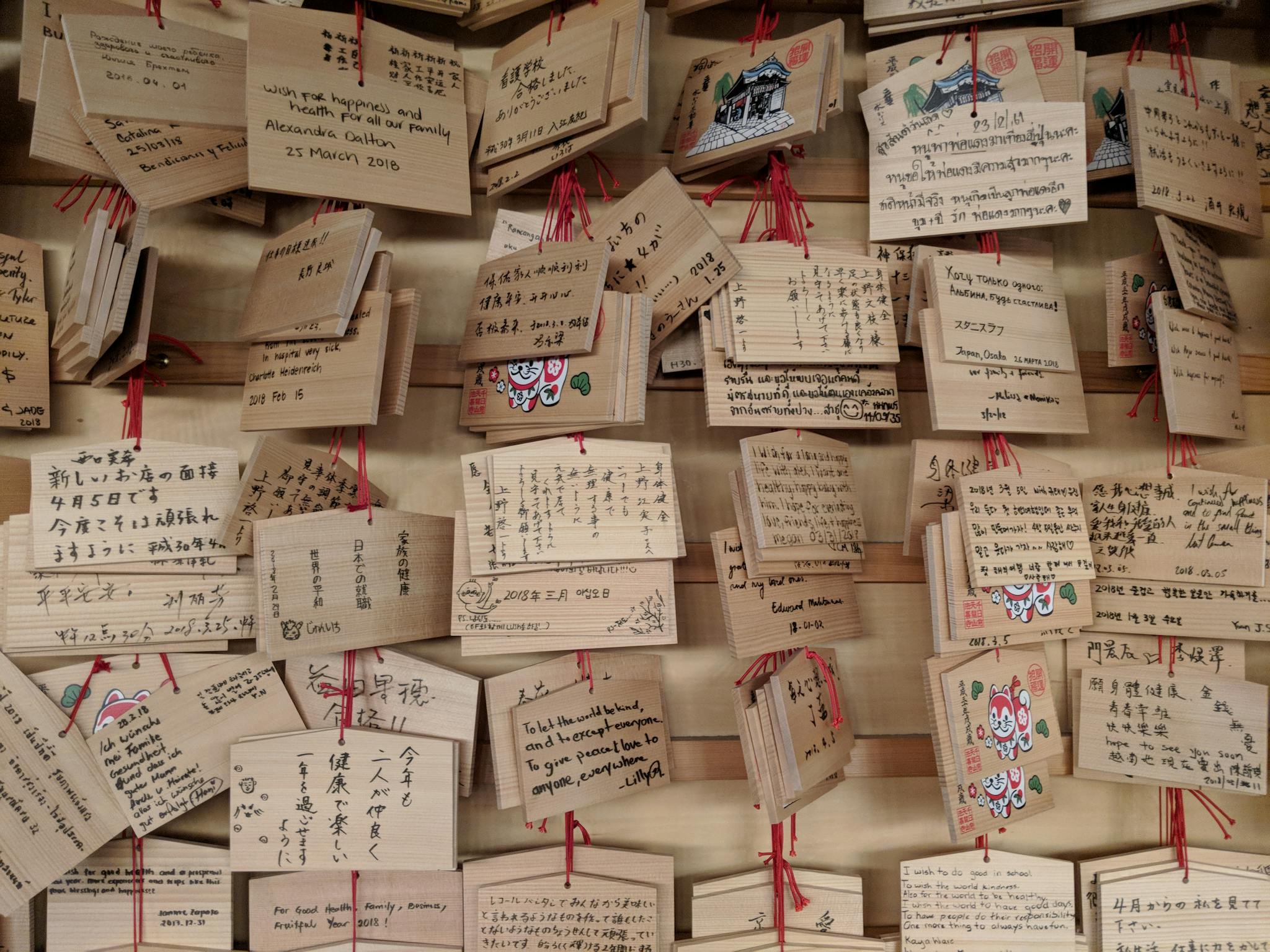Ema plaques with handwritten prayers and wishes in a Japanese shrine, Osaka.
